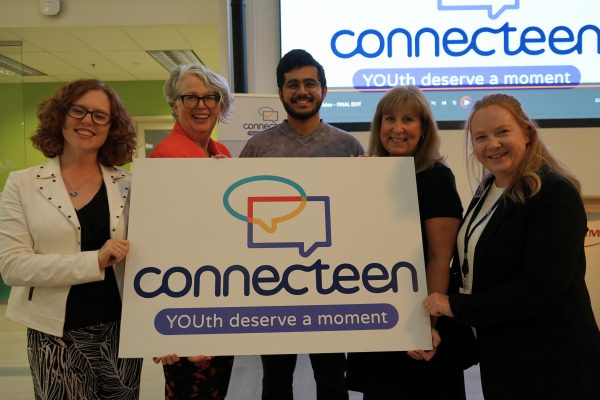 Past and present Teen Line/ConnecTeen volunteers and staff at ConnecTeen's 40th Anniversary Celebration.